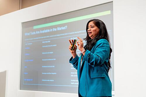 Speaker presenting within the conference